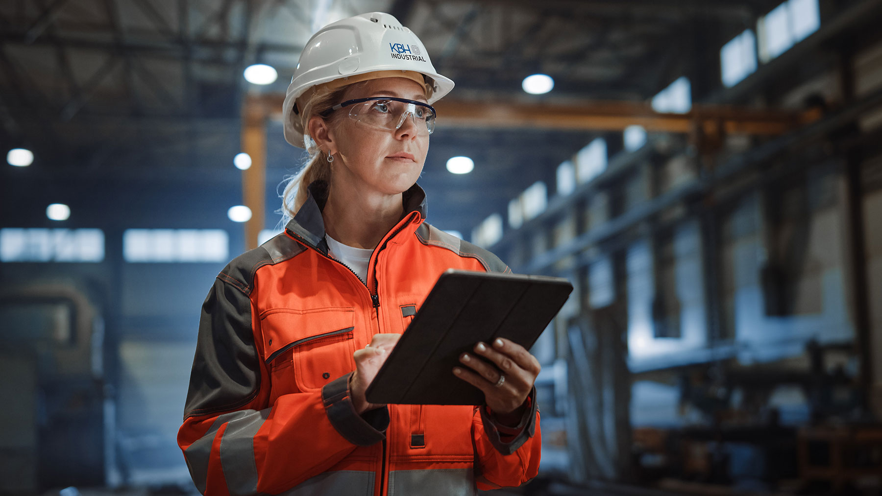 woman in hard hat with clipboard | KBH Industrial safety